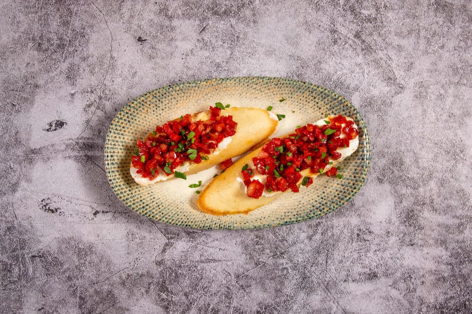 Chorizo crostini with soft cheese and spicy honey