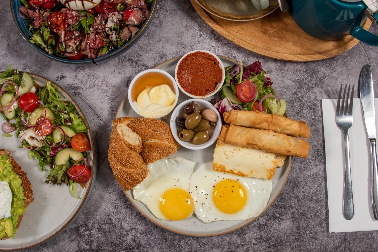 Mediterranean breakfast with eggs, halloumi and olives